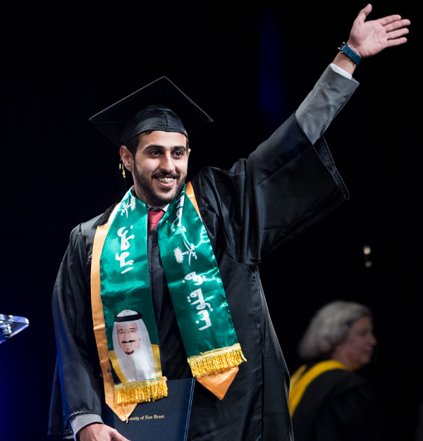 University of New Haven graduates celebrating at commencement